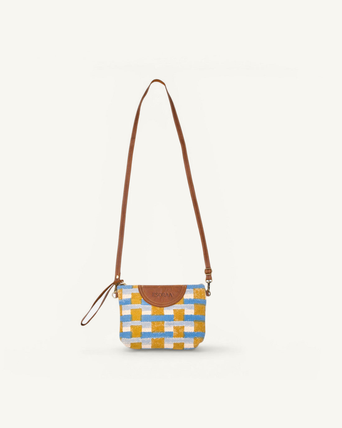Front view of the Esoraa Grid Wasabi bag in green hand-block printed organic cotton with the long shoulder strap for crossbody wear