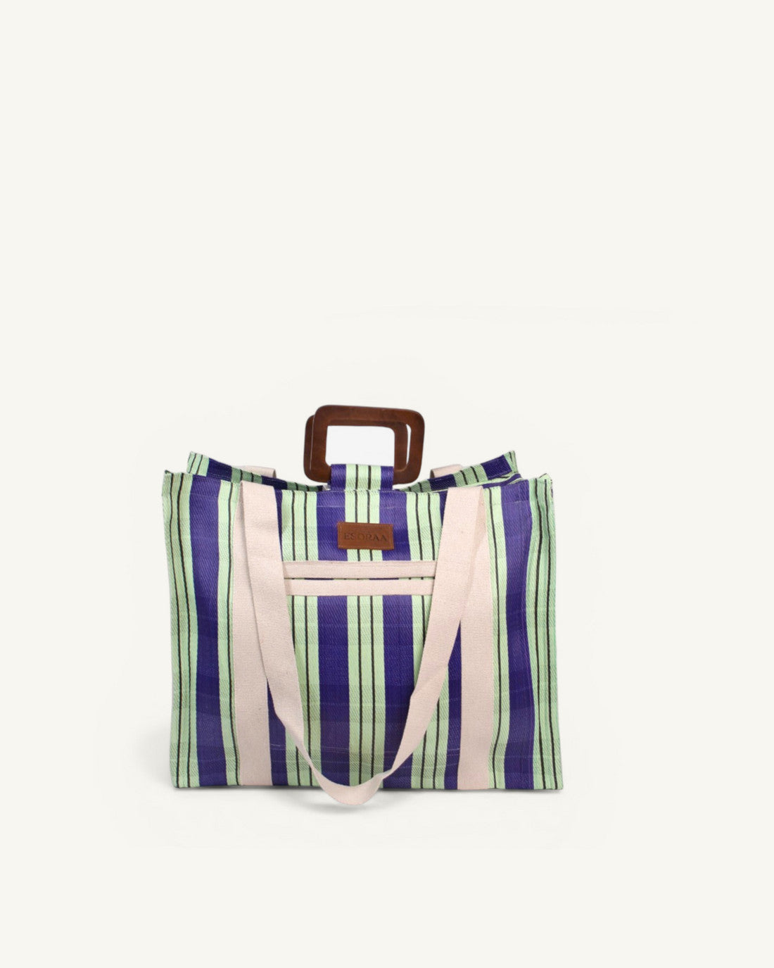 Front view of the Block Mint Royale oversized square bag in mint green recycled nylon with wooden handles and organic cotton shoulder straps.