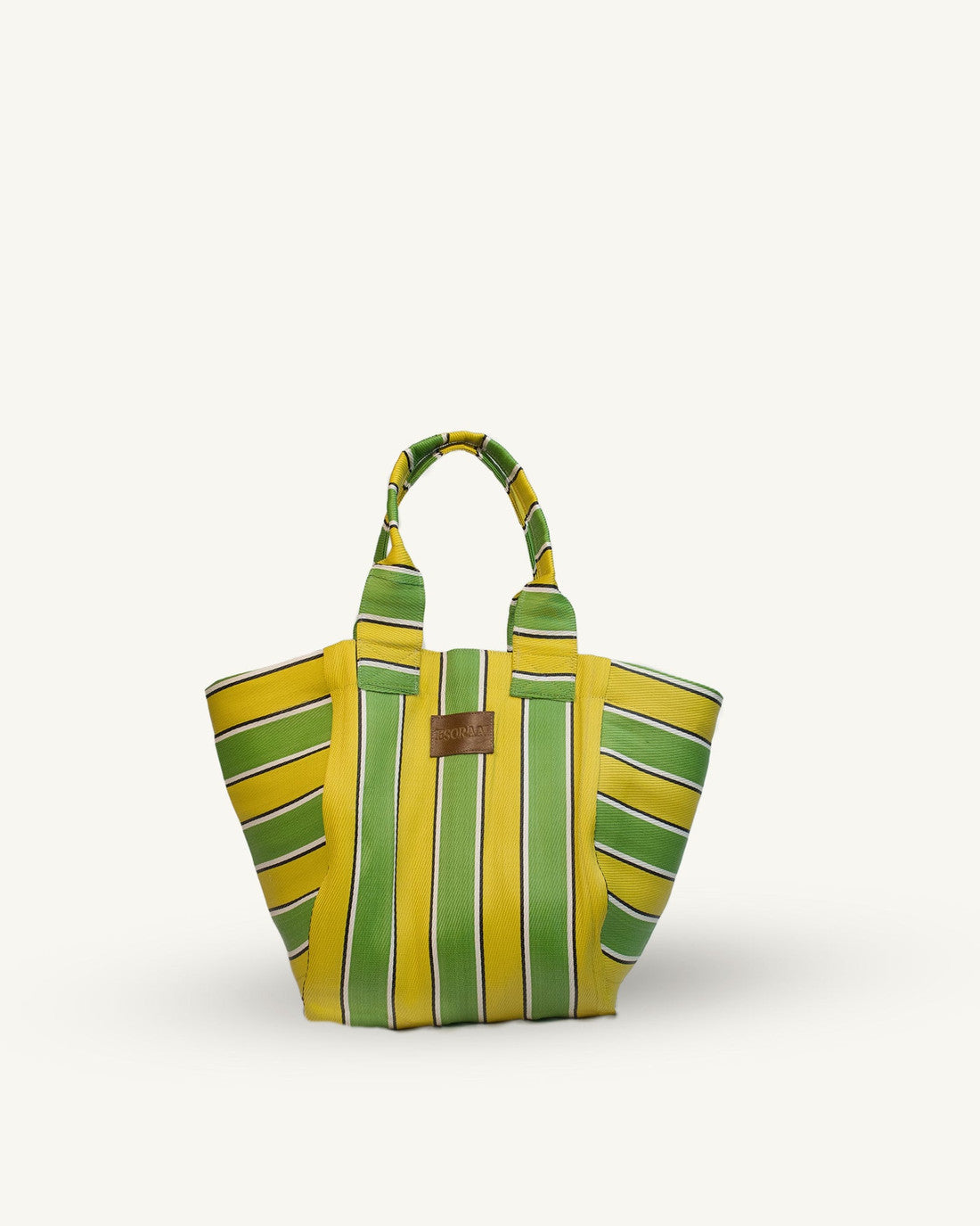 Yellow and green striped handbag on a white background