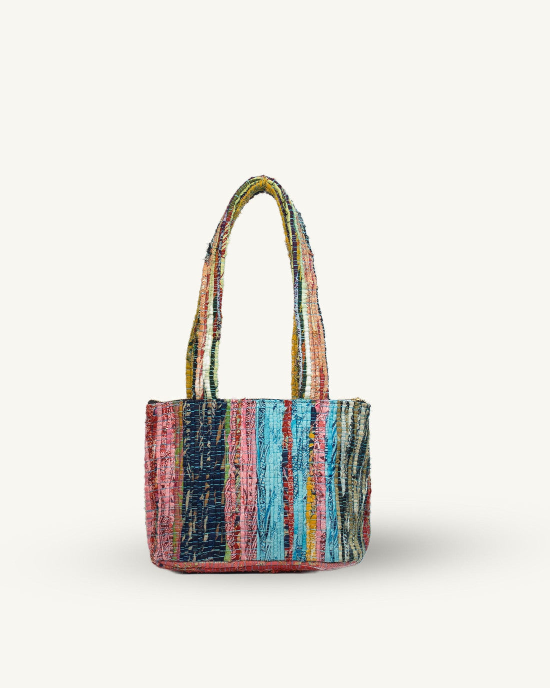 Multicolored striped handbag on a white background