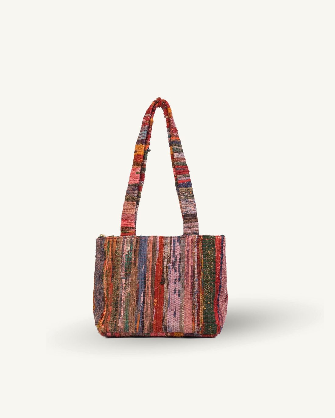 Multicolored striped handbag on a white background