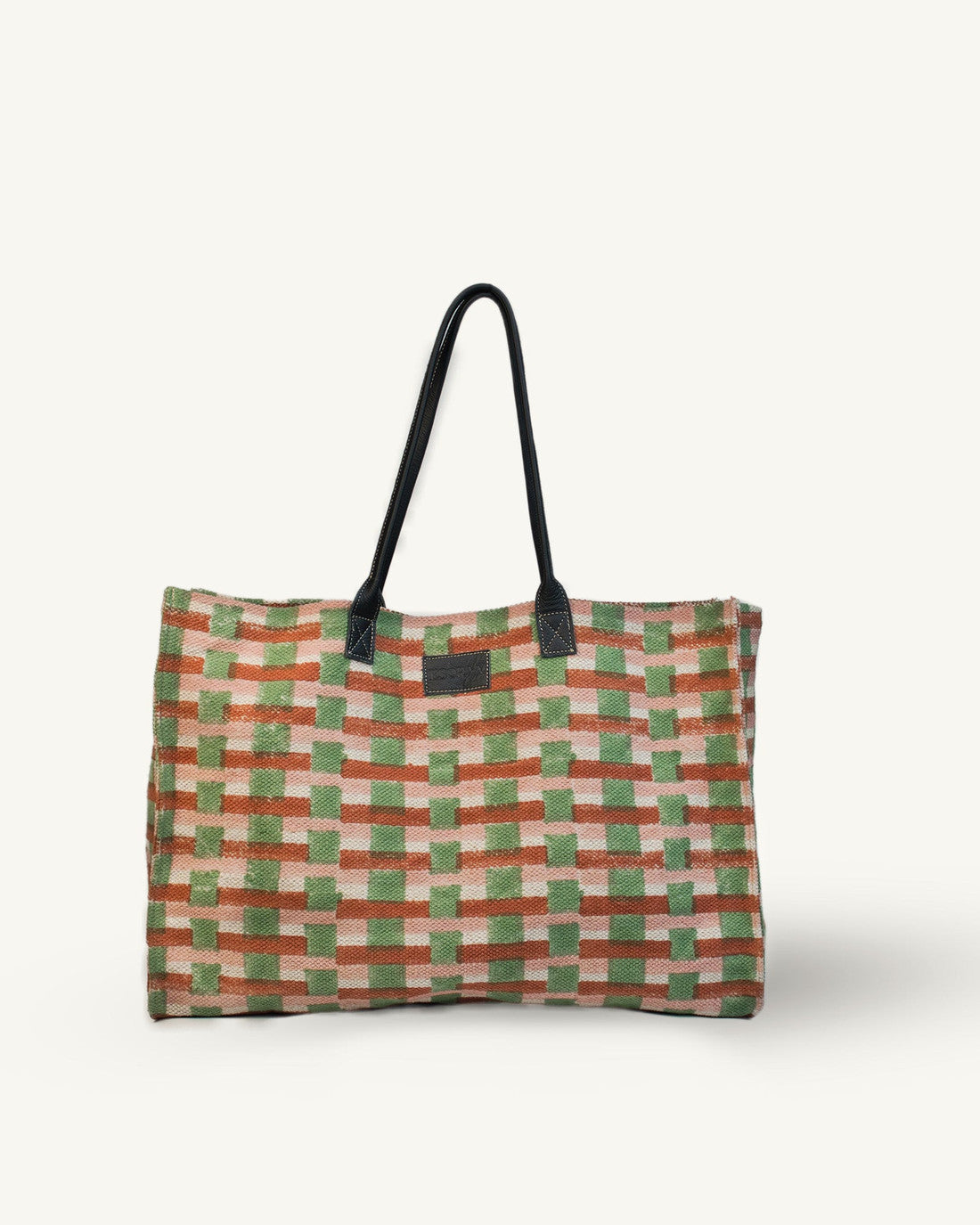Checkered bag with a black handle on a white background