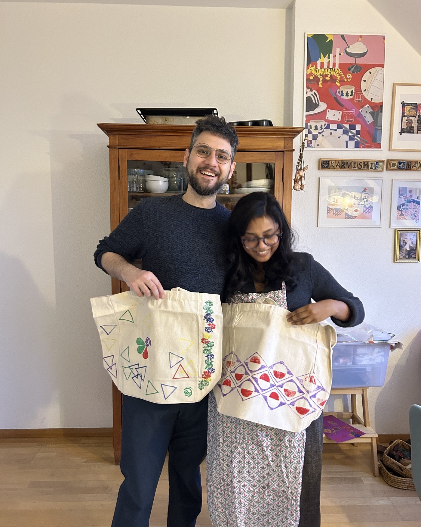Friends showing their finished tote bags