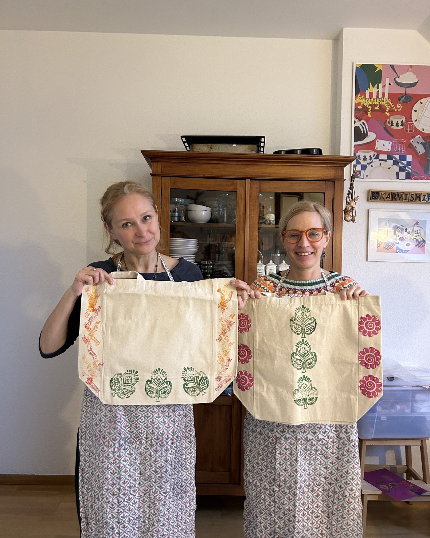 Two friends with their botanical totes