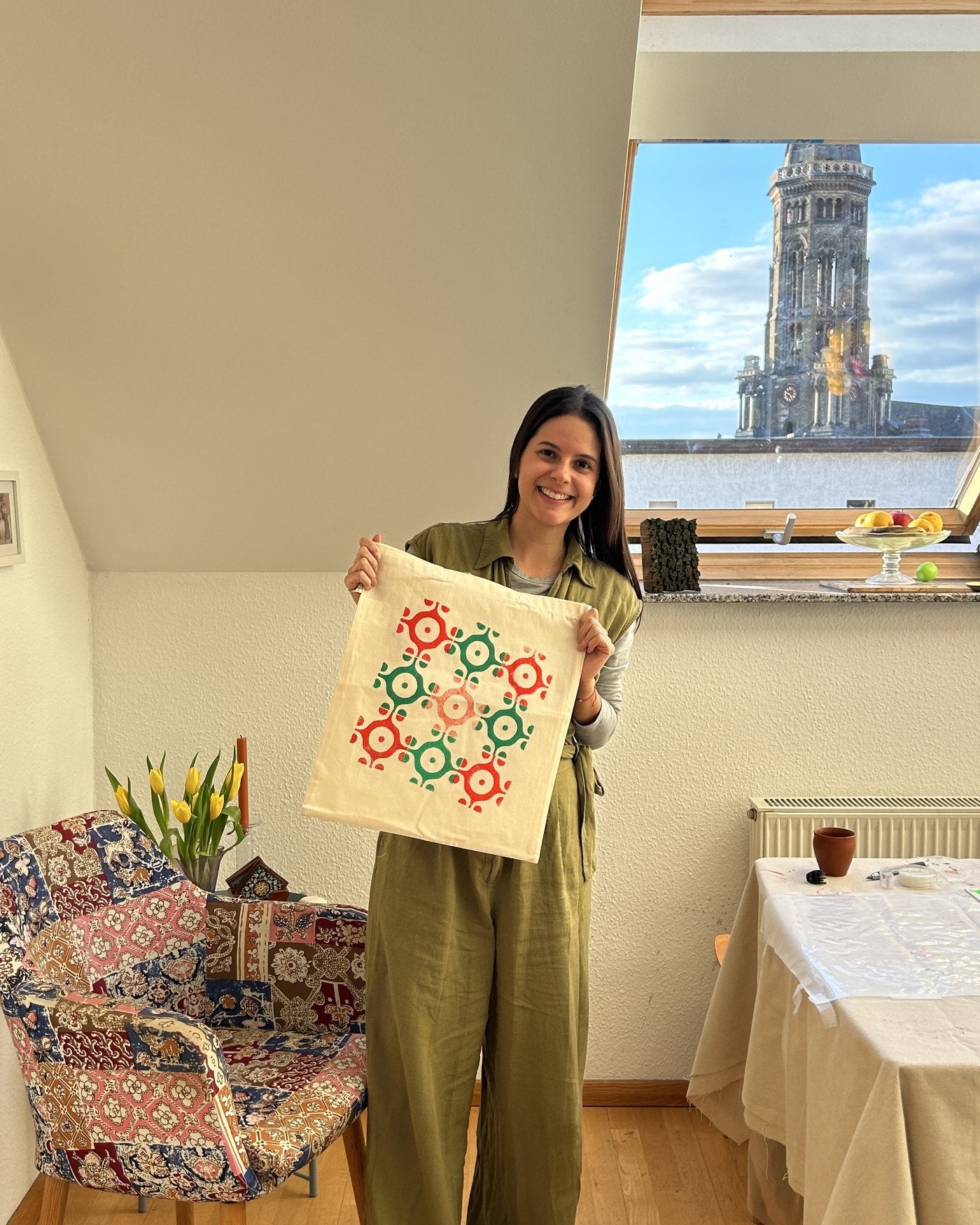 In the bright attic studio with a finished tote