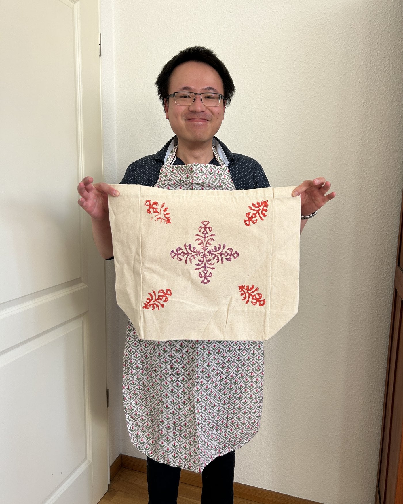A finished tote with a red mandala print