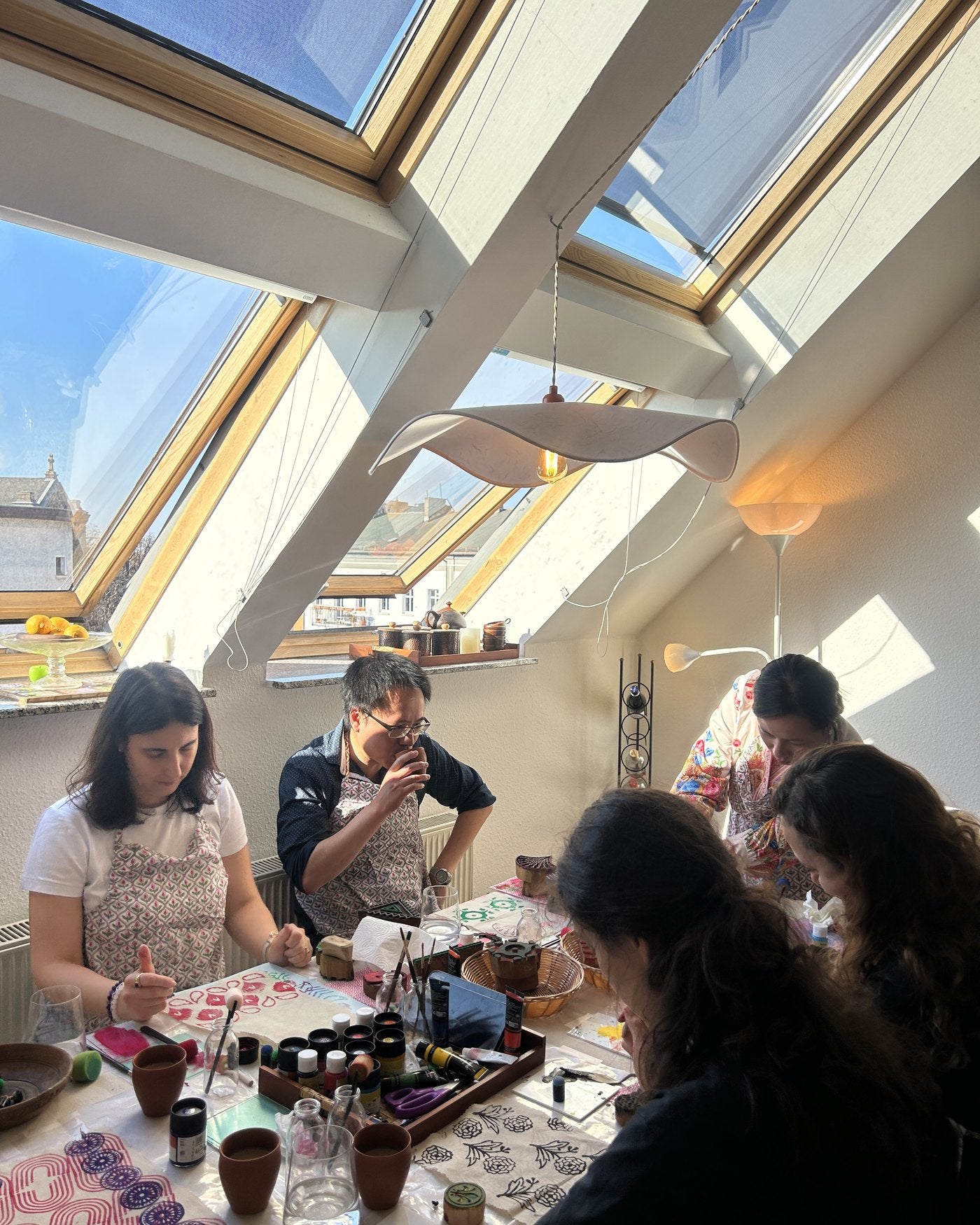 The group printing under the studio skylight