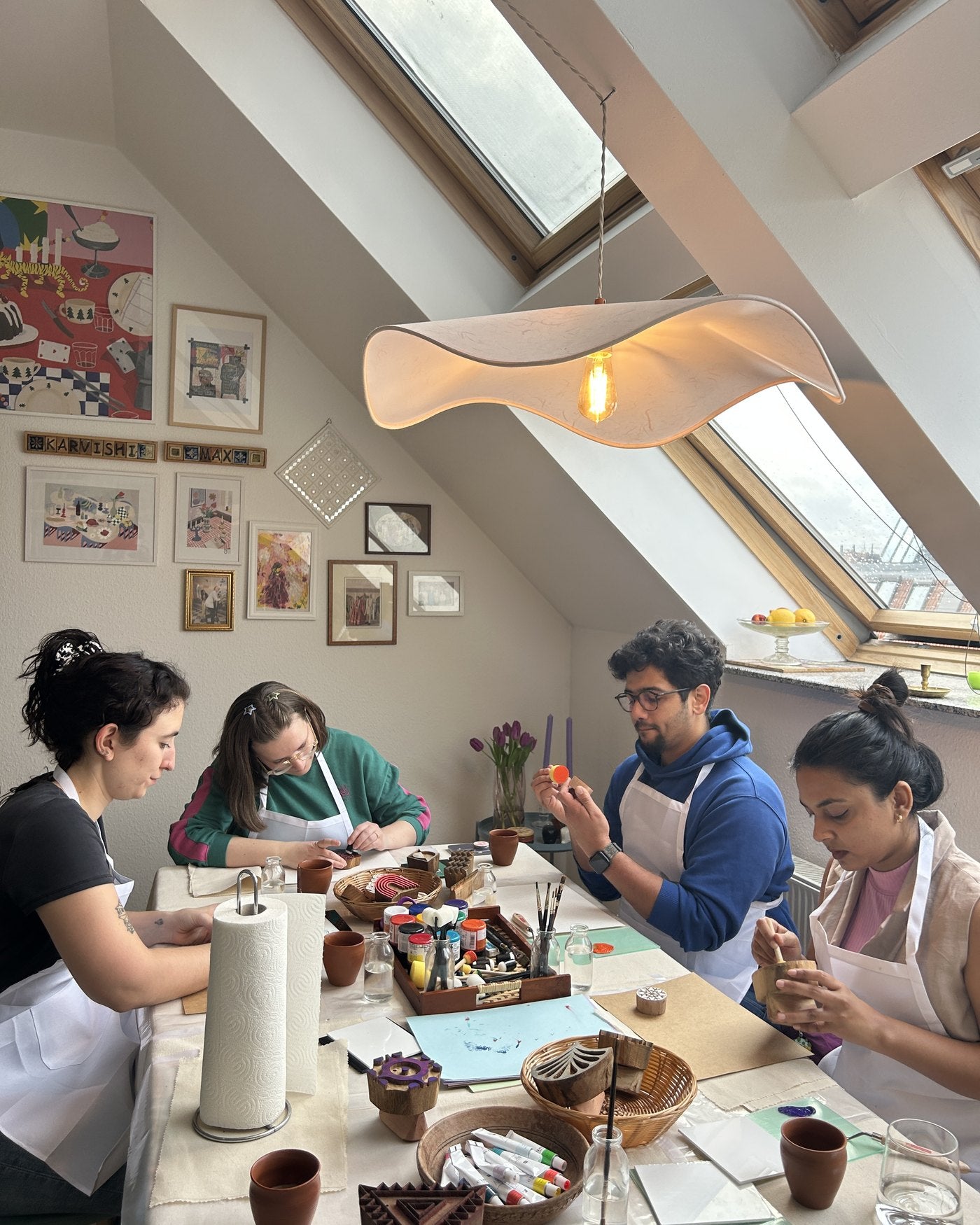 Guests printing together in the attic studio