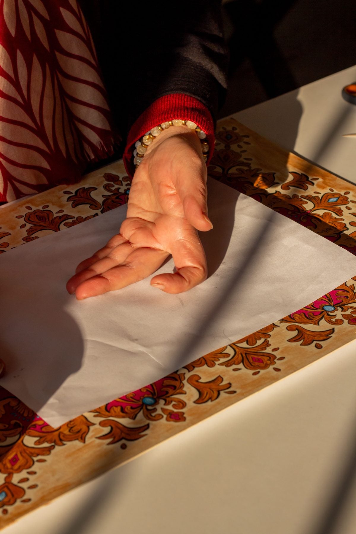 Pressing a hand-stamped card by hand