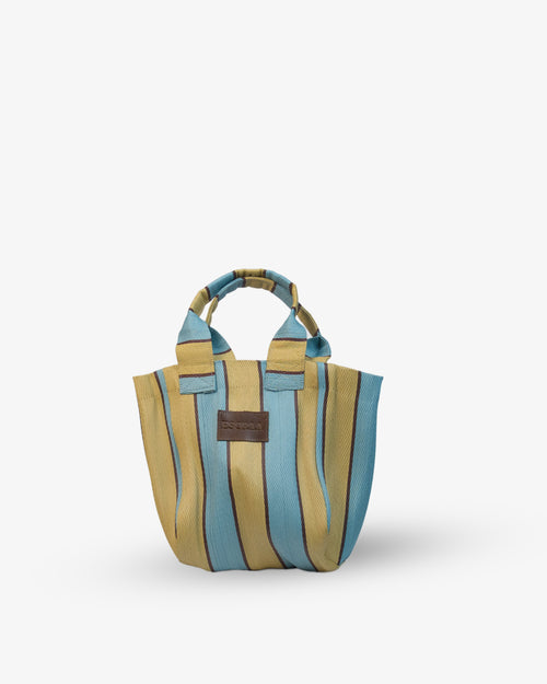 Striped handbag with a brown label on a white background