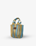 Striped handbag with blue and beige pattern on a white background