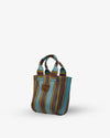 Striped handbag with brown and blue pattern on a white background