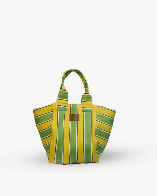 Yellow and green striped handbag on a white background