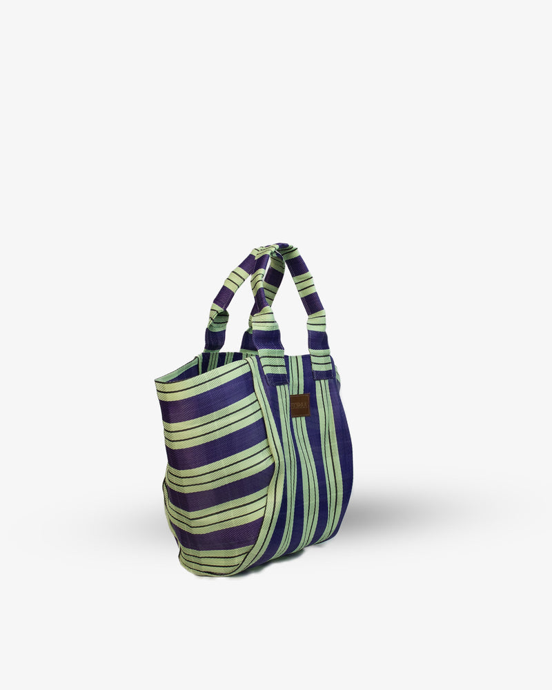 Striped handbag with purple and green pattern on a white background