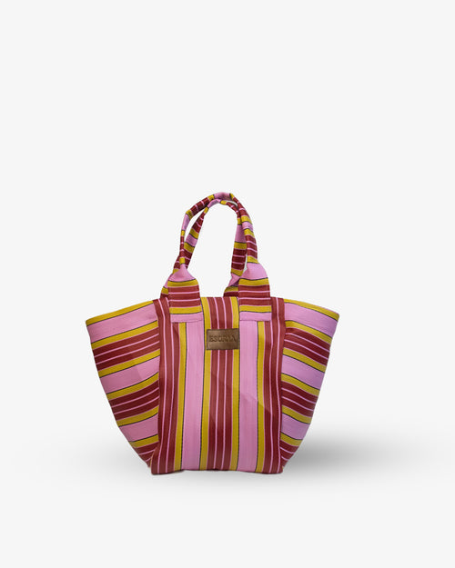 Striped tote bag with pink and yellow pattern on a white background