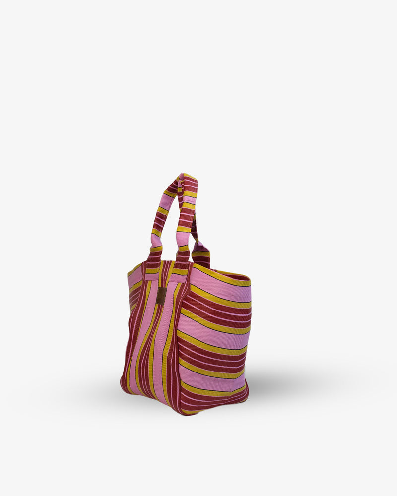 Striped tote bag with pink and brown pattern on a white background