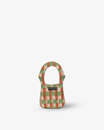 Small checkered bag with a green and brown pattern on a white background