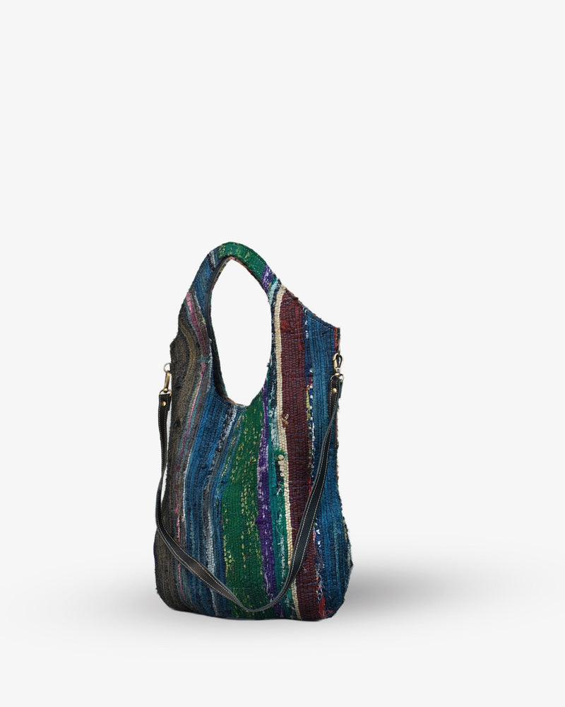 Multicolored striped handbag on a white background