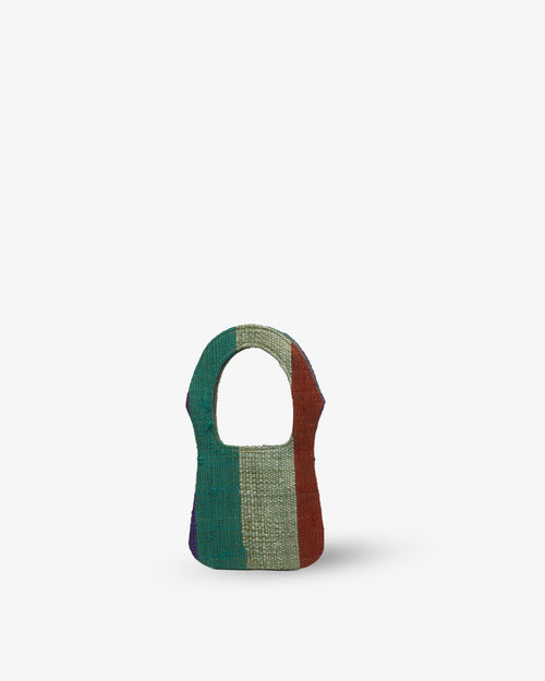 Colorful woven bag on a white background