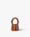 handcrafted bag with a multicolored pattern on a white background