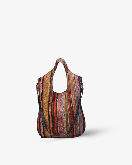 Multicolored striped handbag on a white background