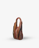 Multicolored handbag with a pattern on a white background