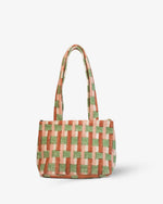 Orange Checkered handbag with green and pink pattern on a white background