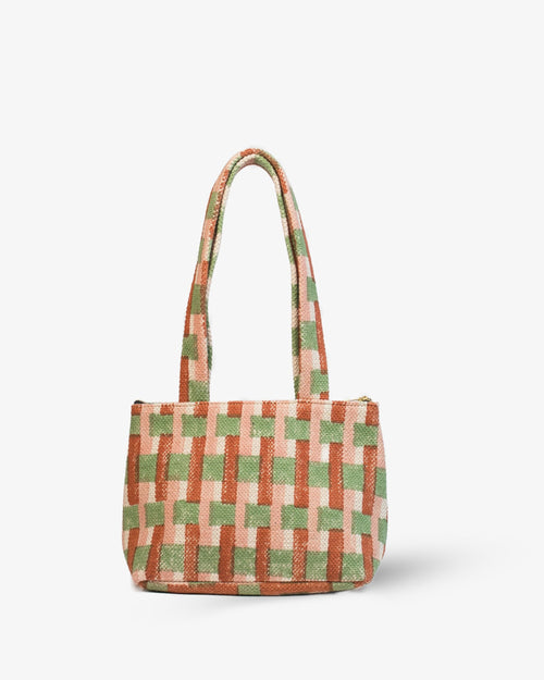 Orange Checkered handbag with green and pink pattern on a white background