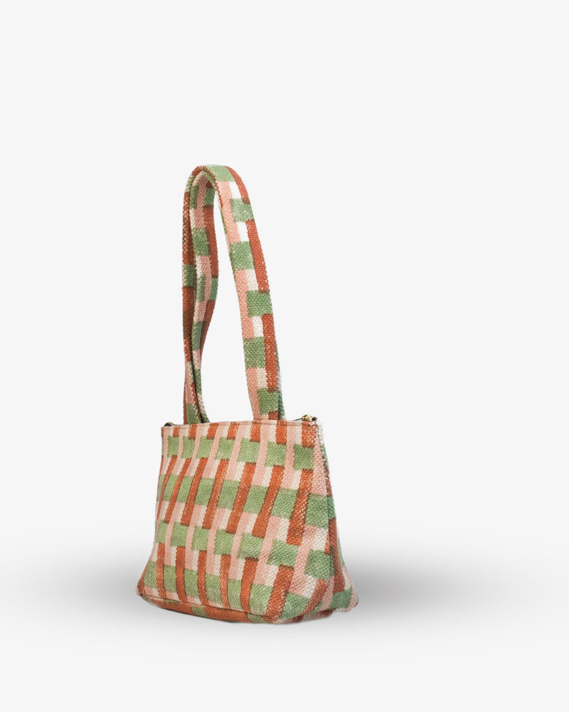 Checkered bag with a handle on a white background