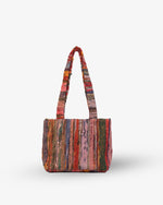Multicolored striped handbag on a white background
