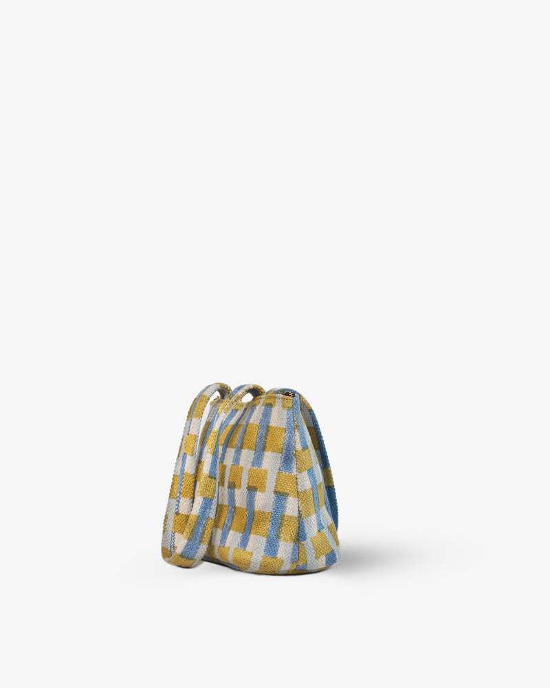 Plaid patterned bag on a white background