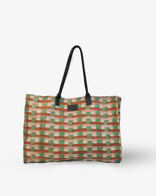 Checkered bag with a black handle on a white background