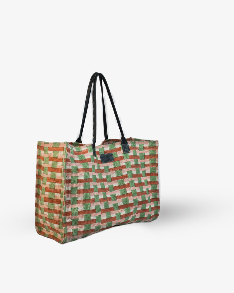 Checkered tote bag with black straps on a white background