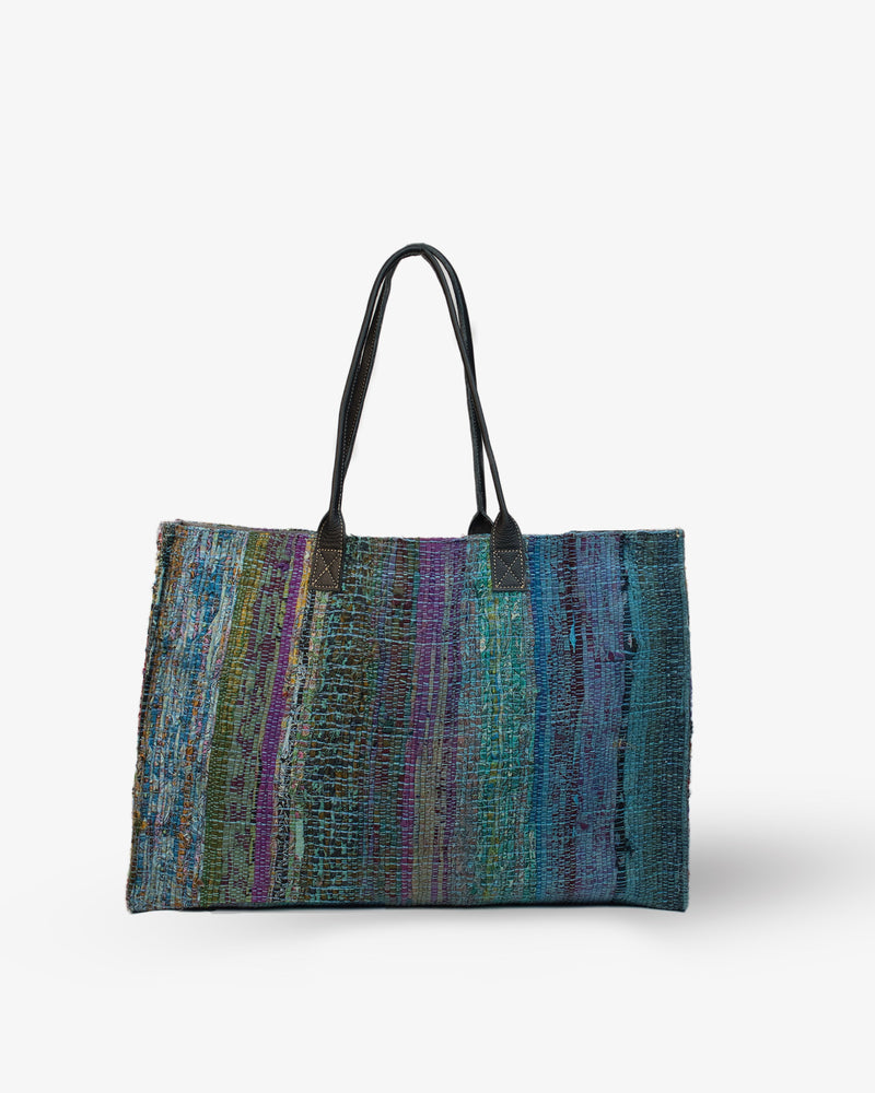 Multicolored Blue striped bag with black handles on a white background
