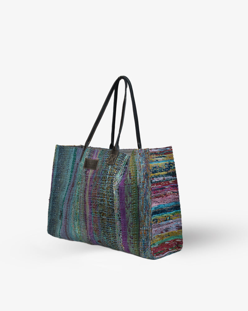 Multicolored striped tote bag on a white background